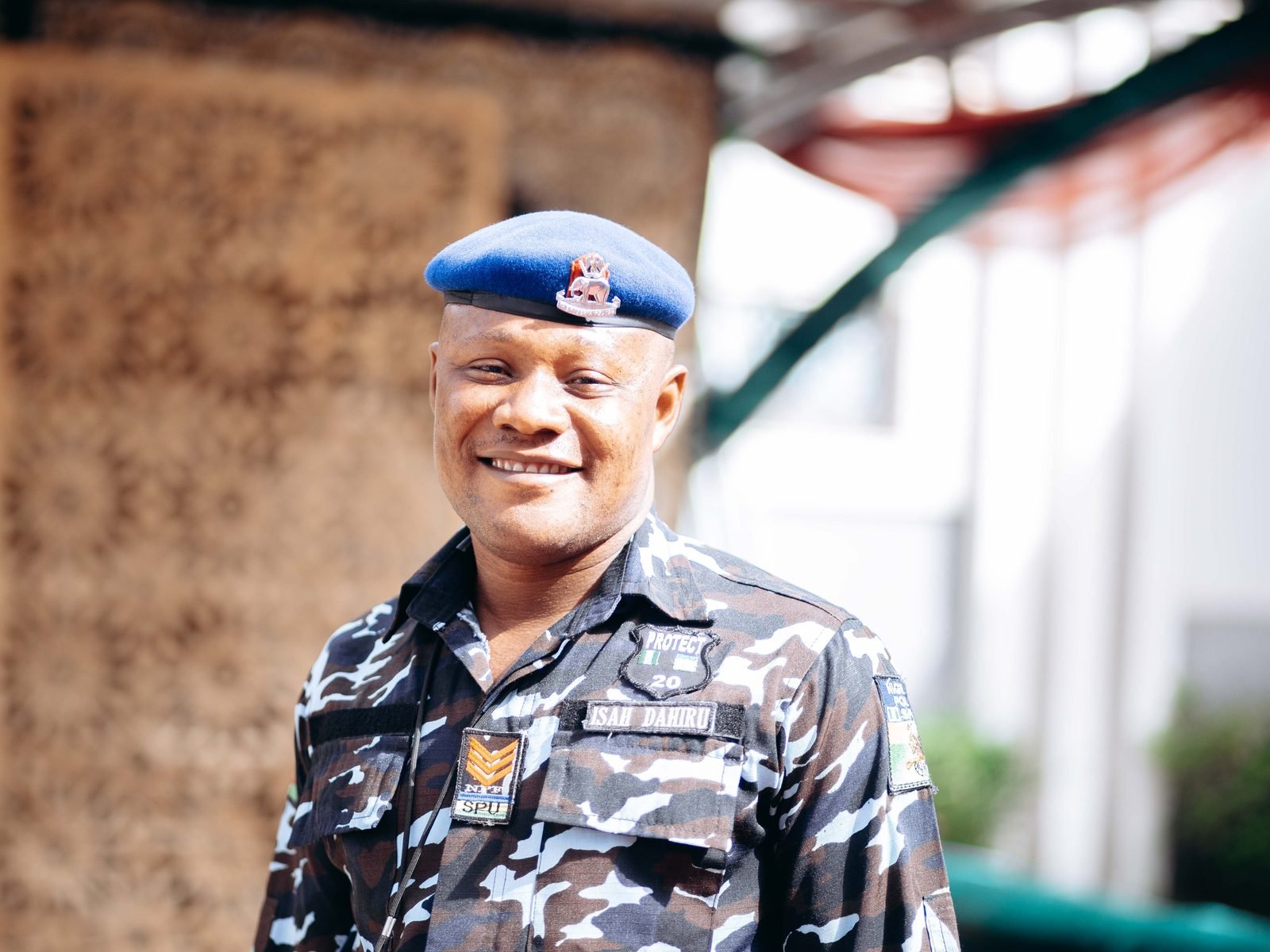 A smiling police officer in uniform